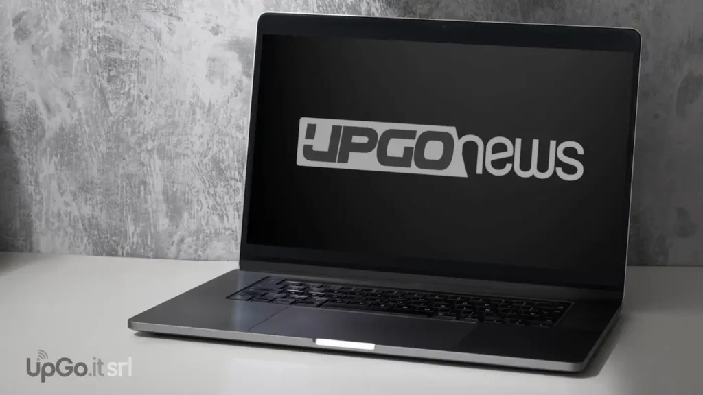 laptop con sopra il logo di UpGo.news